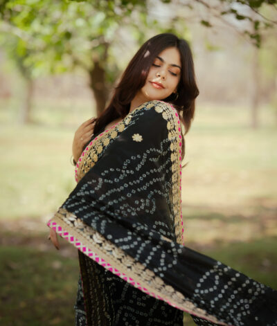 Beautiful black color Rajasthani bandhani print saree with gottapatti work along with blouse piece 
Fabric : cotton silk
